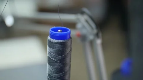 Sewing threads on a sewing machine are unwound Stock Footage 130710631