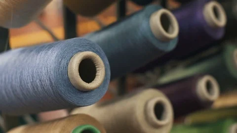 Sewing Threads On Spool. Closeup. Colorful Spools Of Thread. Dolly shot. Video stock 74752257