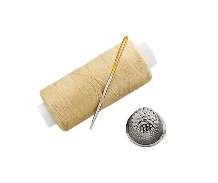 Sewing Threads spool with sewing Needle and Thimble isolated Stock Photos