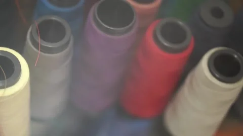 Sewing threads spools in a row. Colorful sewing supplies. Stock Footage 154280830