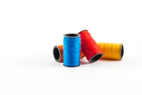 Sewing threads on white background Stock Photos