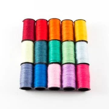Sewing threads on white background Stock Photos