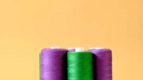 Sewing threads.Purple and green thread spools.Needlework and sewing Stock Footage 153506711