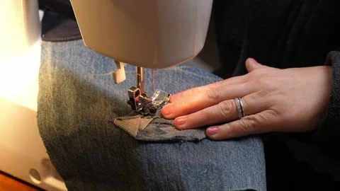 Sewing Timelapse Cloth thread sewing machine scissors cutting creating Stock Footage 320027177