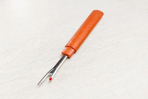 A sewing tool thread handler to open wrong stitches Stock Photos