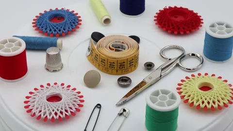 Sewing tools and accessories isolated on white background. Video in 4k. Close-up Stock Footage 221826035