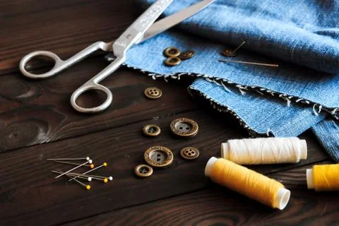 Sewing tools and materials scissors thread needles buttons Stock Photos