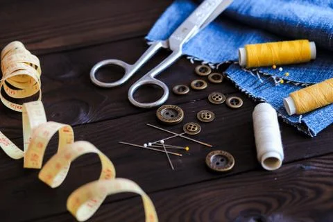 Sewing tools and materials scissors thread needles buttons Stock Photos