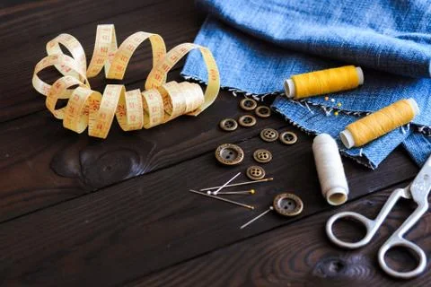 Sewing tools and materials scissors thread needles buttons Stock Photos