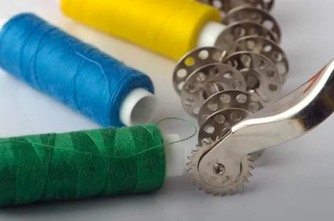 Sewing tools collection. thread, sewing needle, bobbins, in a white backgroun Stock Photos