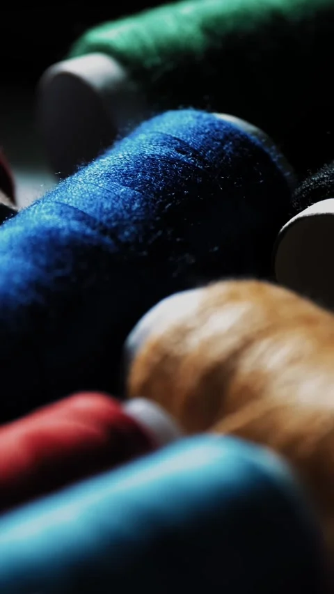Sewing tools. Sewing threads. close-up. rotation. spools of thread of different 動画素材 319293454
