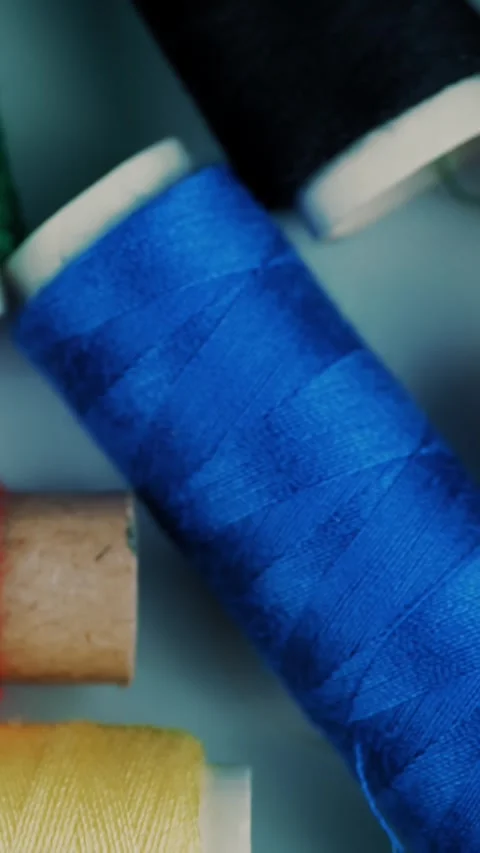 Sewing tools. Sewing threads. close-up. rotation. spools of thread of different Stock Footage 319901973