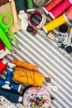 Sewing tools on striped background Stock Photos