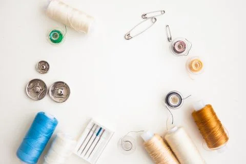 Sewing tools on the white background with copy space in center Stock Photos