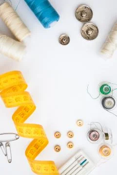 Sewing tools on the white background with copy space in center Stock Photos