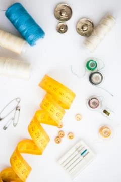 Sewing tools on the white background with copy space in center Stock Photos