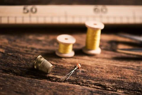 Sewing tools on wooden table Stock Photos