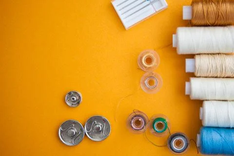 Sewing tools on the yellow background with copy space Stock Photos