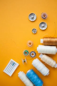 Sewing tools on the yellow background with copy space Stock Photos
