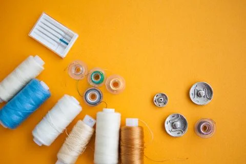 Sewing tools on the yellow background with copy space Stock Photos