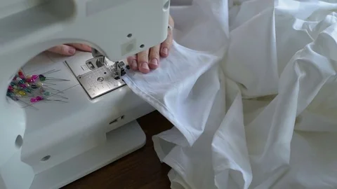 Sewing a white sheet Stock Footage 79644457