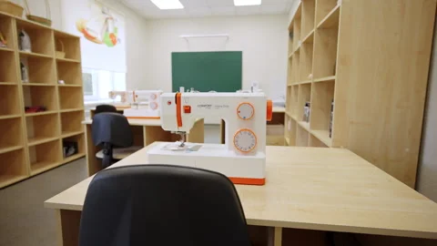 Sewing workshop with machines on tables for training Stock Footage 332718548