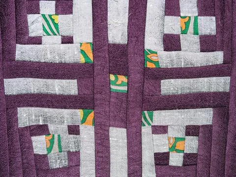 Sewn fragment of patchwork with silver pattern Stock Photos