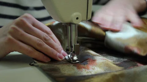 Sews on sewing machine 11 Stock Footage 33454201