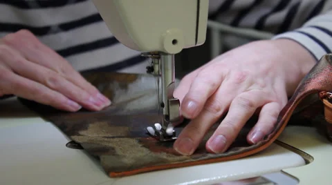 Sews on sewing machine 13 Stock Footage 33459230