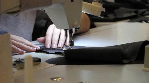 Sews on sewing machine 3 Stock Footage 33307796