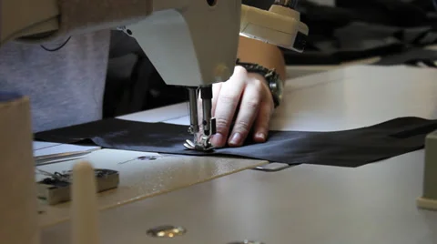 Sews on sewing machine 4 Video stock 33307927