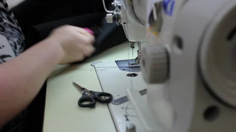 Sews on sewing machine 6 Stock Footage 33311633