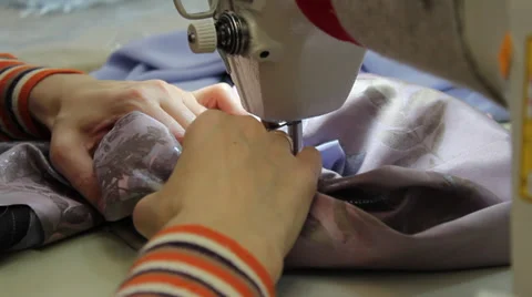 Sews on sewing machine 8 Stock Footage 33311800