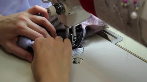 Sews on sewing machine 9 Video stock 33450571