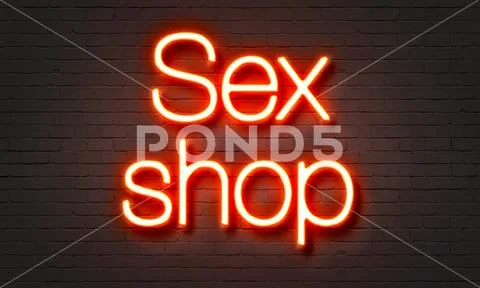 Sex shop neon sign on brick wall background. Stock Illustration