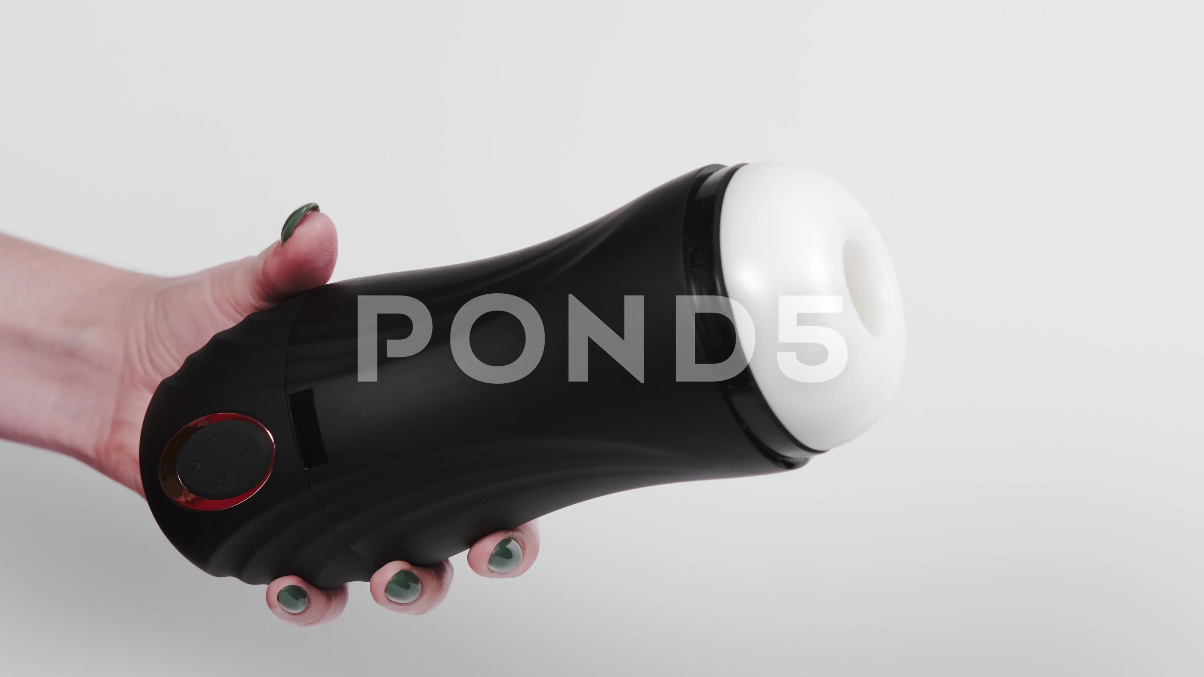 Sex toys for men. An artificial vagina for masturbation in the hands of a  girl o