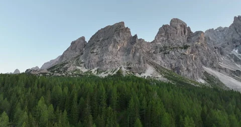 Sexten Dolomites peaks over forest at sunset in South Tyrol Stock Footage 346647460