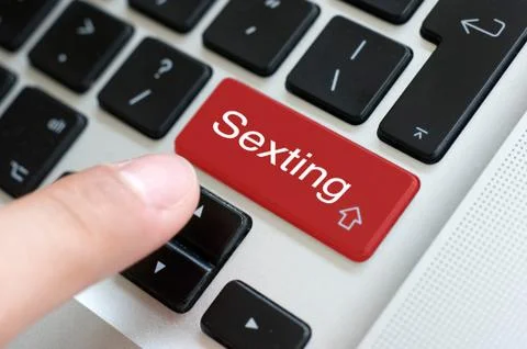 Sexting button on laptop Stock Photos