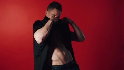 Sexual man dance on red background Stock-Footage 95718774