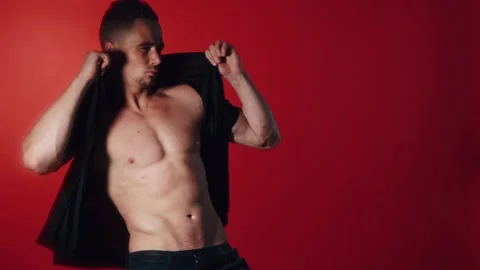 Sexual man dance on red background Stock Footage 95718804