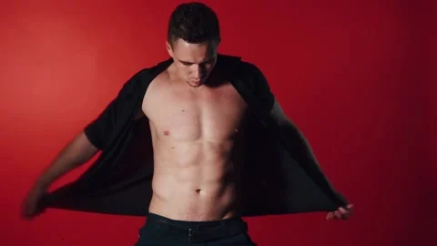 Sexual man dance on red background Stock Footage 95718882