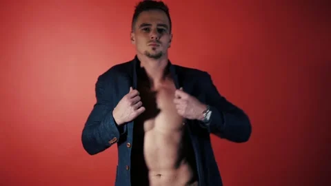 Sexual man dance on red background Stock Footage 95719057