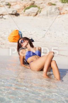 Sexy beautiful model laying. having fun on shore Stock Photos