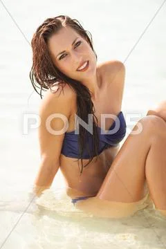 Sexy beautiful model laying. having fun on shore Stock Photos