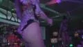 Sexy blond girl demonstrating hot body while dancing on bar HD Footage