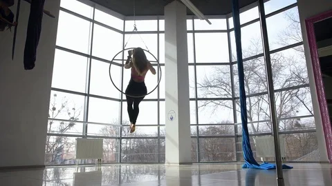 Sexy blonde dancing on the pole in the white dance studio Stock Footage 73227753