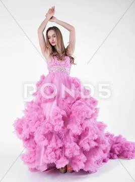 Sexy blonde in pink dress Stock Photos