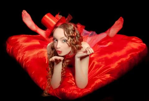 Sexy burlesque dancer stripper in red corset and red hat with brautiful lrgs, Stock Photos