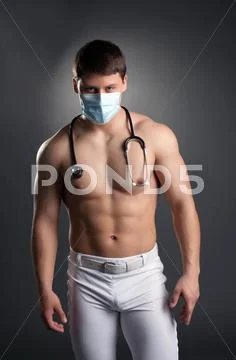 Sexy dancer in doctor costume with stethoscope Stock Photos