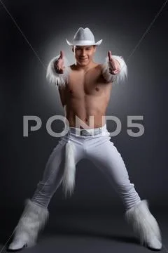 Sexy dancer in white cowboy costume Stock Photos